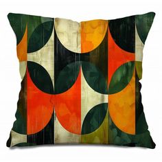 an orange and green throw pillow on a white background with black, yellow, and red circles