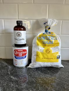 ingredients to make powdered sugar sit on a counter