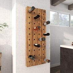 a wall mounted wine rack with bottles on it