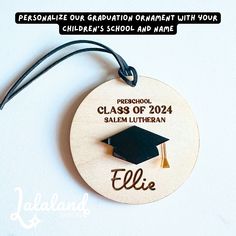 a wooden ornament with a graduation cap on it's back and the words, personalize our graduation organization with your children's school and maree