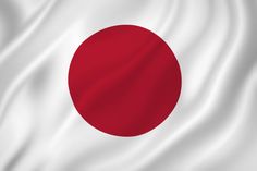 the flag of japan is waving in the wind