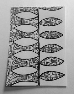 an abstract drawing on paper with black and white lines in the shape of fish's tails