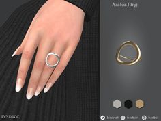 a woman's hand with two rings on it and an image of the ring