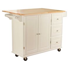 a white kitchen island with drawers on wheels