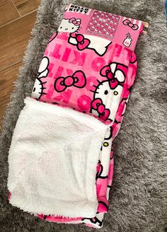 a hello kitty diaper is laying on the floor