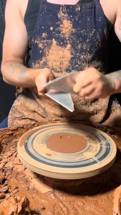 a person is making something out of clay