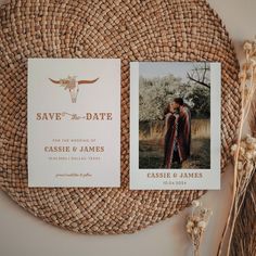 save the date cards on top of a wicker basket next to dried flowers and an antelope