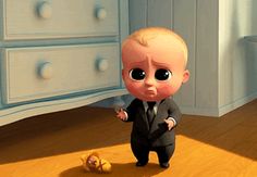 an animated baby in a suit standing next to a teddy bear on the floor,