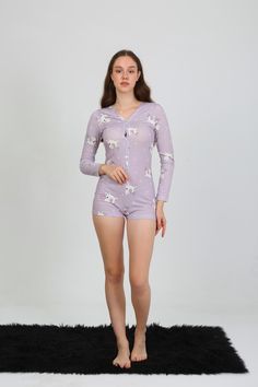 Drift into dreamland with this adorable Lavender Unicorn Romper Pajama Set! 🦄💜 Covered in a playful unicorn print, this long-sleeve romper is perfect for cozy nights or lounging in style. Crafted from soft, stretchy fabric, it provides the ultimate comfort while the button-down front adds a touch of convenience and charm. Whether you're cuddling up with a book or getting ready for a slumber party, this romper will have you feeling magical! ✨🌙 Product Highlights: 🦄 Unicorn Print: Adorable unicorn design all over gives this pajama set a fun, whimsical vibe. 👚 Long-Sleeve Romper: Stay cozy and cute with this full-sleeve romper, perfect for cooler nights. ✨ Button-Down Front: Functional button-down design makes it easy to wear while adding a stylish detail. 💫 Soft & Stretchy Fabric: Made Sleepwear Women Pajamas, Backless Romper, Comfortable Loungewear, Adult Pajamas, Unicorn Print, Unicorn Design, Slumber Party, Womens Pyjama Sets, Pajama Set Women