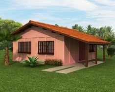 a small pink house sitting in the middle of a lush green field with palm trees