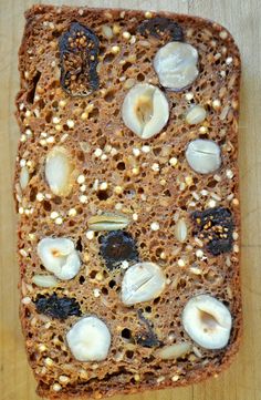 a piece of bread with nuts and seeds on it