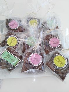 chocolate cookies wrapped in cellophane with tags on them