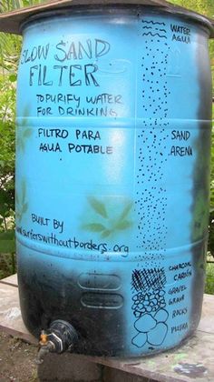 a large blue water tank sitting on top of a wooden table