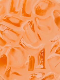 an orange background with many different shapes and sizes