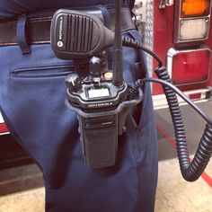 there is a camera attached to the back of a firetruck's bag