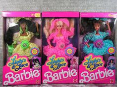 three barbie dolls are in the same package