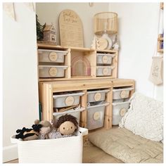 a toy storage unit with baskets and toys in it