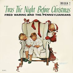 an old christmas album cover with two children sitting in a chair and one is holding the baby