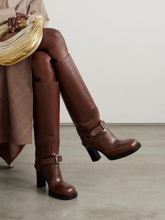 Burberry's knee boots are inspired by the label's equestrian heritage. Crafted from leather, they have buckled straps, chunky round toes and the house's archival logo embossed on the soles. Burberry Boots, Fall Winter Shoes, Leather Thigh High Boots, Designer Runway, Leather Knee Boots, Heeled Pumps, Stirrup Leathers, Equestrian Boots, Designer Slippers