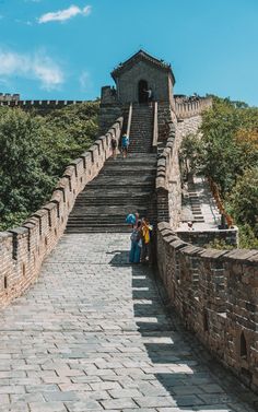 people walking up and down the stairs at the great wall of china, which is one of the most popular tourist attractions in asia