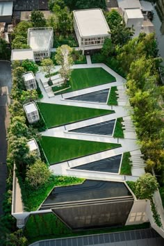 an aerial view of some houses in the grass