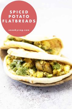 two pita breads filled with different types of food and the words spiced potato flatbreads