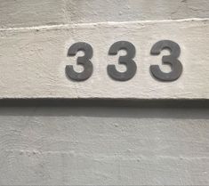 the numbers are on the side of a building