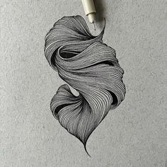 an ink drawing of a long haired woman's hair on a piece of paper