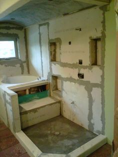 an unfinished bathroom is being built in the process of remodeling it's walls