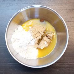 ingredients in a metal bowl on a wooden table