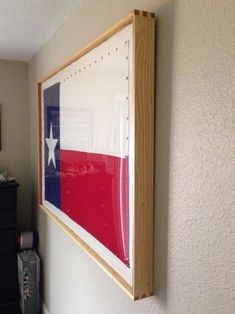 an american flag is hanging on the wall