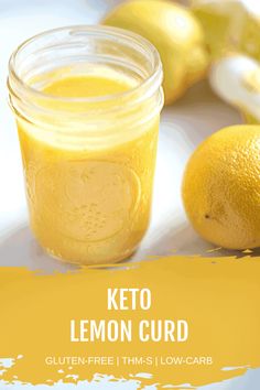 a glass jar filled with lemon curd next to two lemons