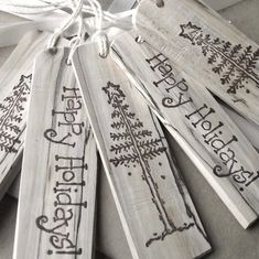 wooden tags with the words happy holidays on them