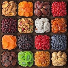 an assortment of dried fruits and nuts arranged in squares