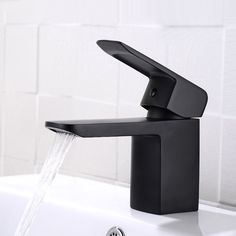 a black faucet with water running from it