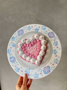 a heart shaped cake sitting on top of a plate