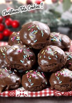 a pile of chocolate covered cookies sitting on top of a table