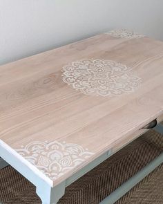 a wooden table with white paint on it