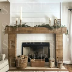 a living room with a fire place and two candles on top of the fireplace mantel