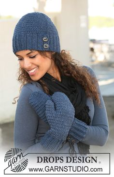 a woman wearing a blue hat and gloves