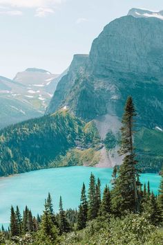 a mountain lake surrounded by trees and mountains