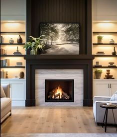 a living room filled with furniture and a fire place in the middle of it's fireplace