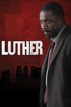 a man in a suit and tie standing next to a red background with the words luther on it