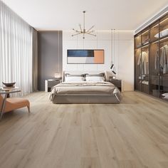 a bedroom with wood flooring and glass doors leading to a walk - in closet