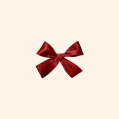 a red bow on a white background