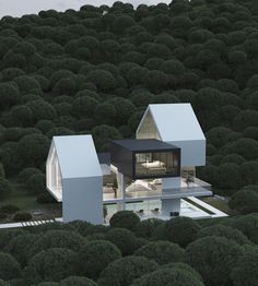 an aerial view of a house in the middle of a tree - lined area with trees