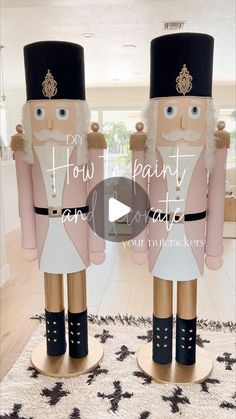 two wooden nutcrackers are standing in the middle of a room with black and white carpet