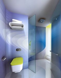 a bathroom with blue and white walls, a yellow toilet and a glass shower stall