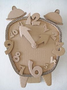 a clock made out of cardboard with numbers on it