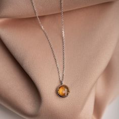 Dainty Citrine necklace in 14K white gold, yellow gold or rose gold. Dainty natural citrine pendant on 14K solid gold chain with a spring clasp. A great birthday gift choice by Kyklos Jewelry as citrine is the November birthstone. 100% handcrafted with love! ● Metal: 14K solid gold, 14K white gold or 14K rose gold ● Gemstone: Citrine, round briolette cut  ● Stone Diameter: 10mm (0.4in) ● Length: 39cm (15.5in) to 47cm (18.5) HOW TO ORDER - CUSTOM ORDERS ●Choose from the drop down menus the availa Hallmarked Citrine Jewelry In Orange, White Gold Diamond Cut Citrine Jewelry, Orange Citrine Hallmarked Jewelry, White Gold Citrine Necklaces With Gemstones, Amber Necklace Hallmarked For Anniversary, Luxury Amber Necklace With Polished Finish, Orange Citrine Round Jewelry, Amber Hallmarked Necklace For Anniversary, Fine Jewelry Citrine Bezel Setting